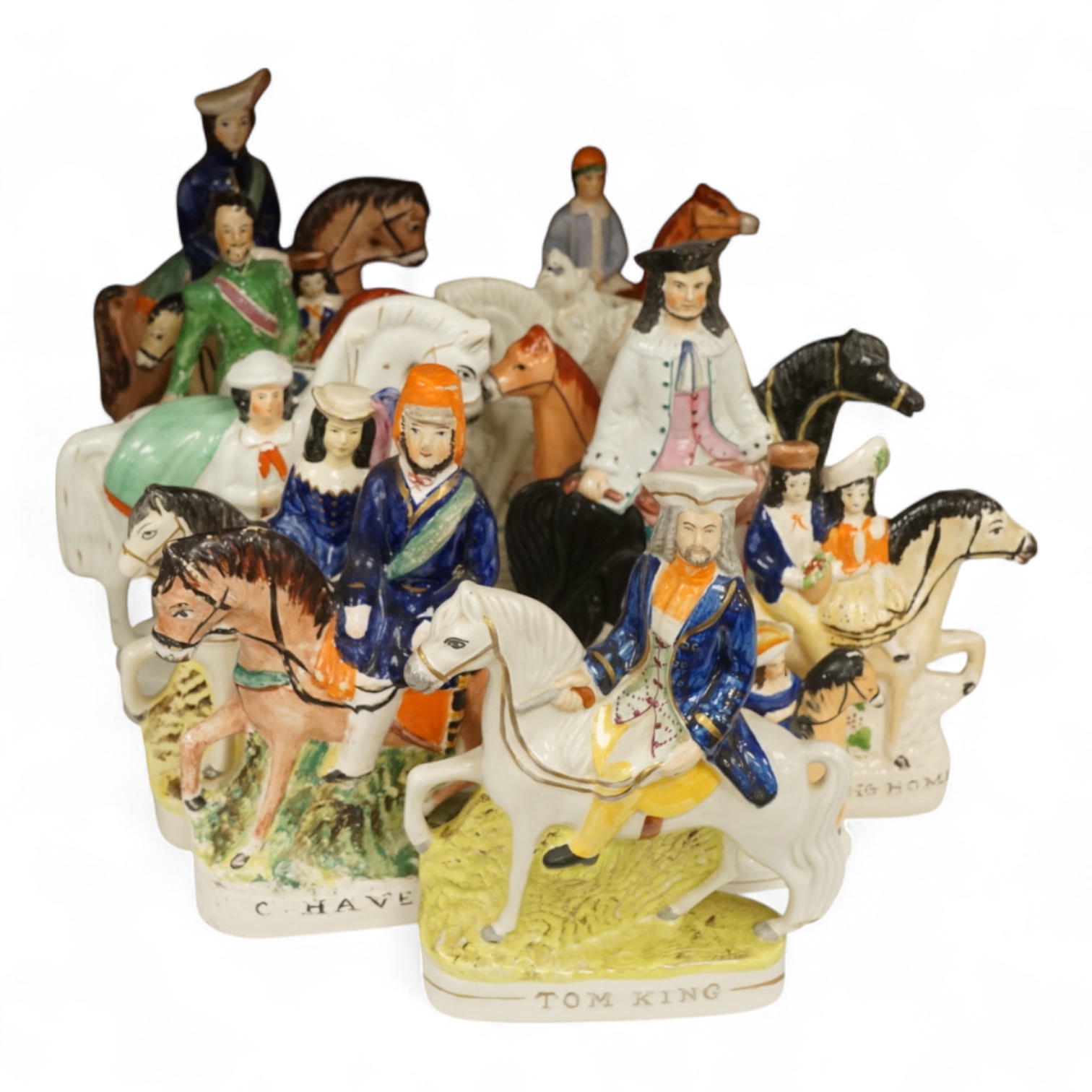 Thirteen Staffordshire pottery equestrian figures to include Tom King, Dick Turpin and Sir Colin Campbell, largest 28cm high